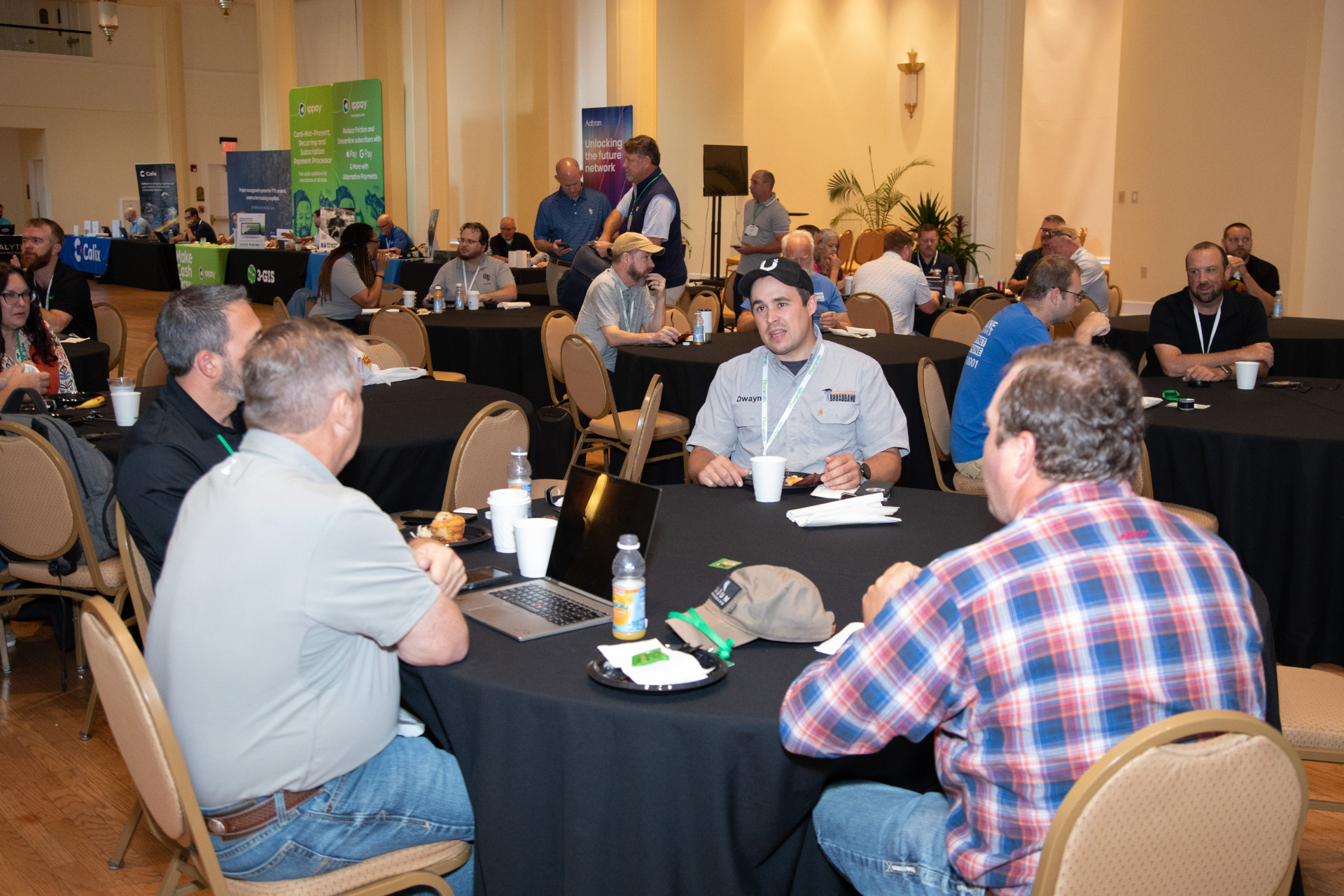 Attendees in peer conversation at a past Vision User Conference